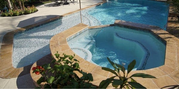 pool with spa and landscape